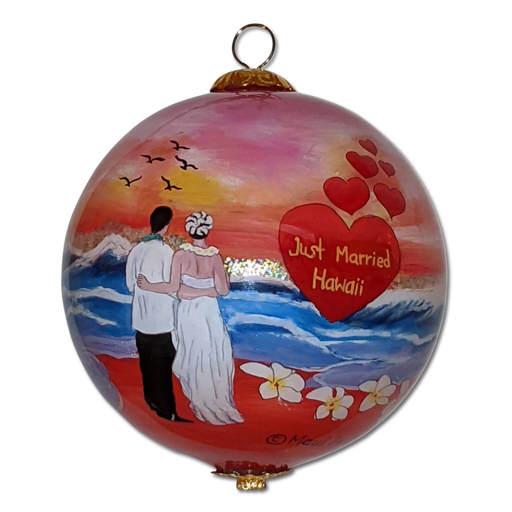 Hawaiian ornament with newly married couple and plumeria flowers