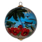 Hawaiian Christmas ornament from Maui by Design hand painted with honu sea turtles, canoe, and tropical flowers